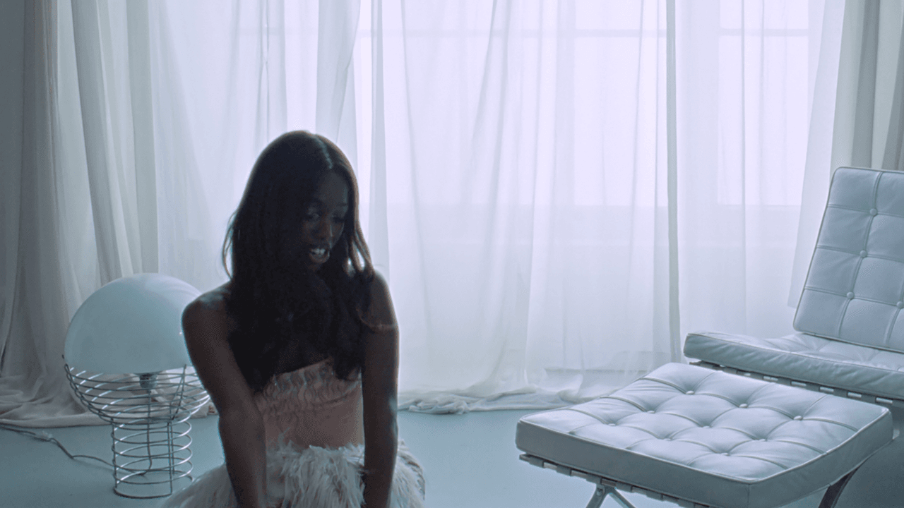 Watch John Glacier Live Out Her 007 Fantasies in New “Bond Girl” Video